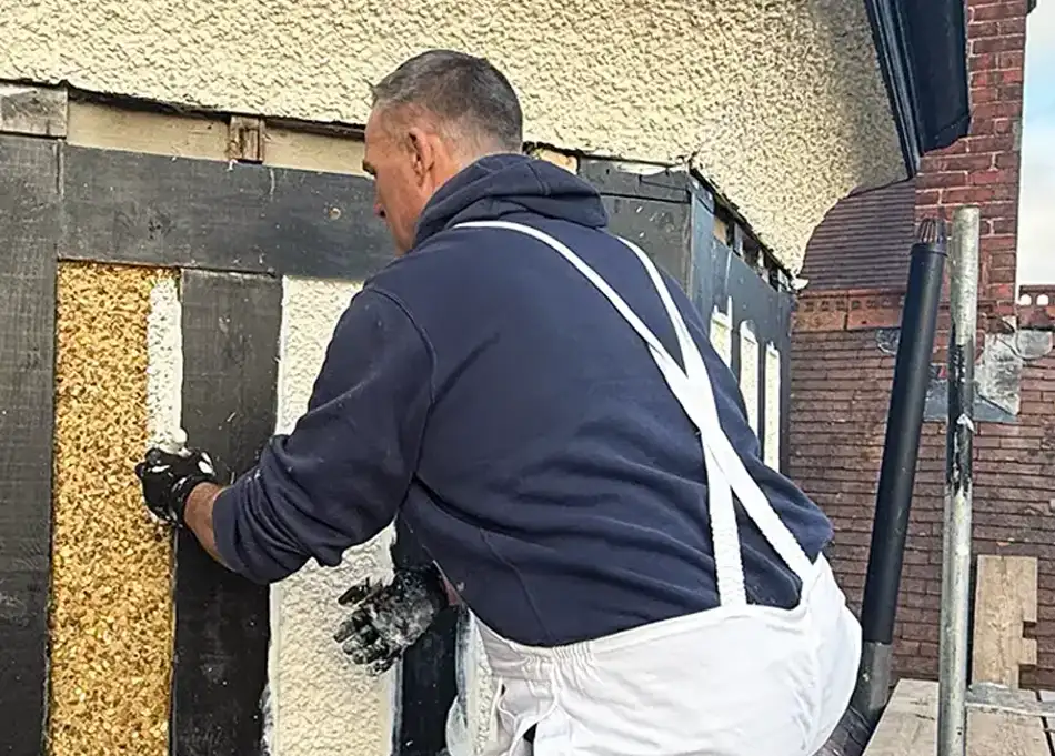 Graham Sparks of GS Outdoor Property Services repairing a roof